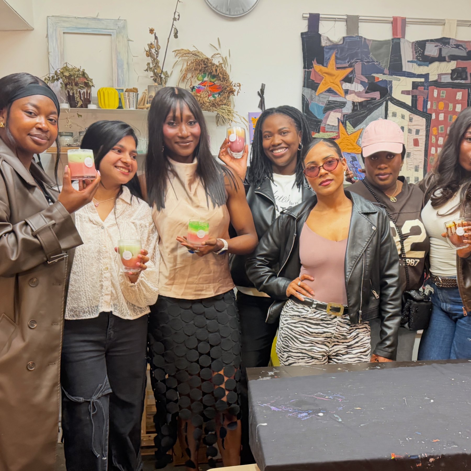 Friends showing their handmade candles
