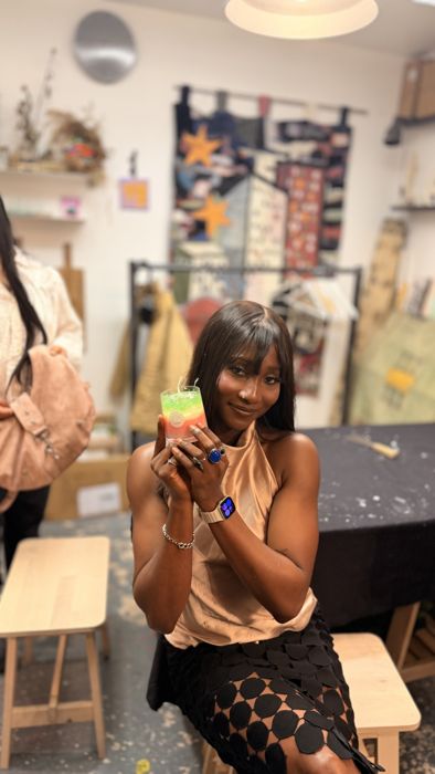 A guest holding her candle at the workshop